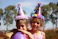 Colorful kids birthday party with balloons and happy children playing outdoors.