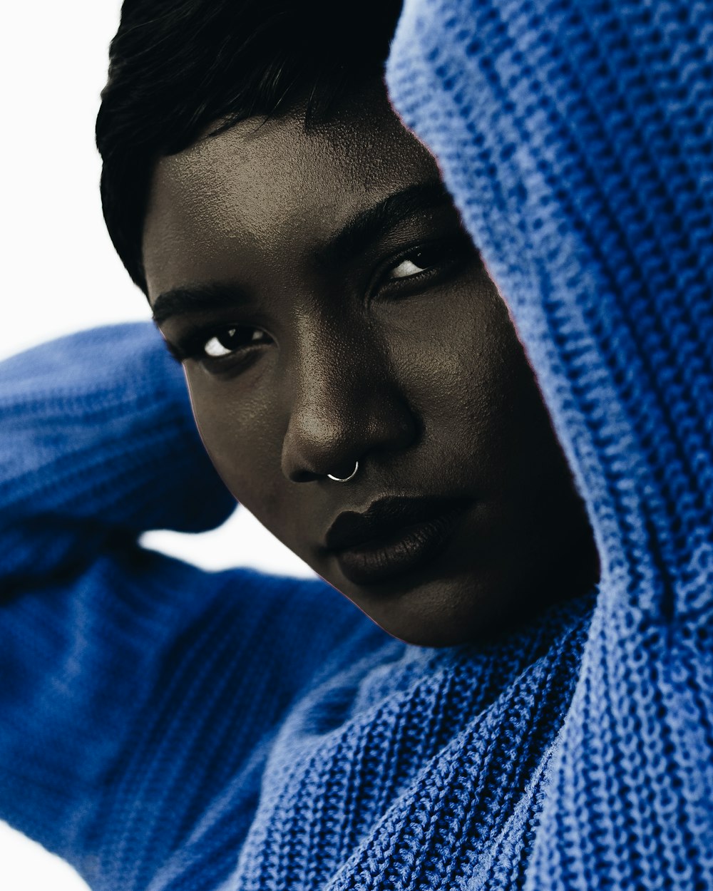 woman wearing blue knit sweatshirt