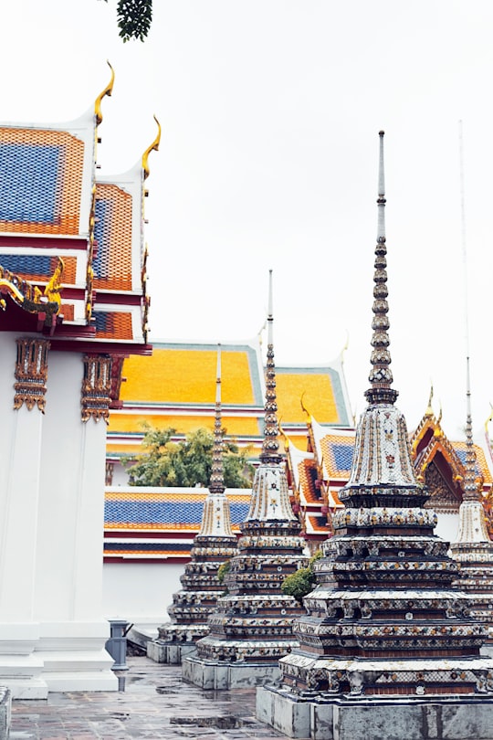 gray and white concrete buildings in Wat Phra Chetuphon Vimolmangklararm Rajwaramahaviharn Thailand