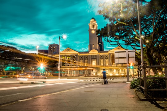 time lapse photography of a highway near church in Victoria Theatre Singapore