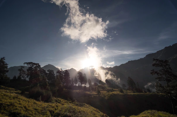 A serene landscape of the Andes mountains at sunrise.