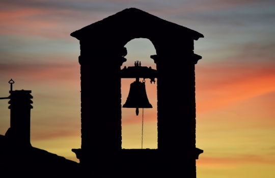 silhouette of church bell during sunset in Casale Marittimo Italy