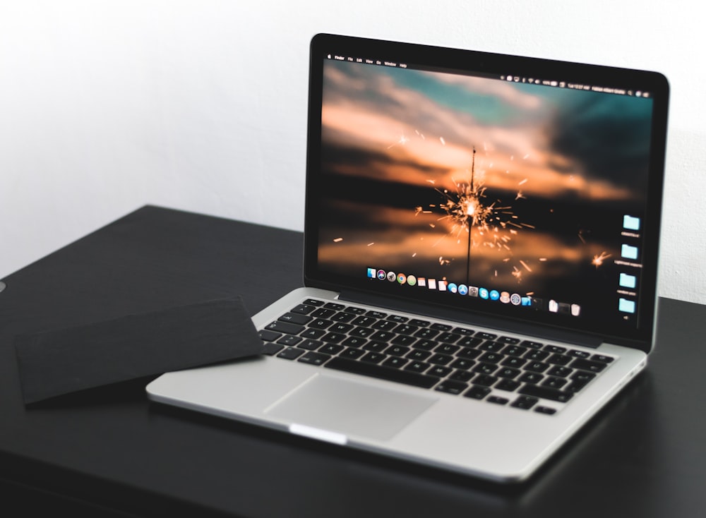 MacBook Pro on wooden table