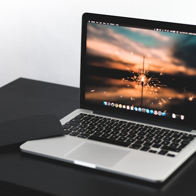 MacBook Pro on wooden table