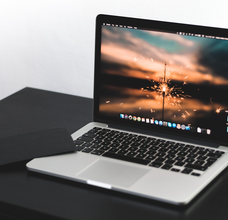 MacBook Pro on wooden table