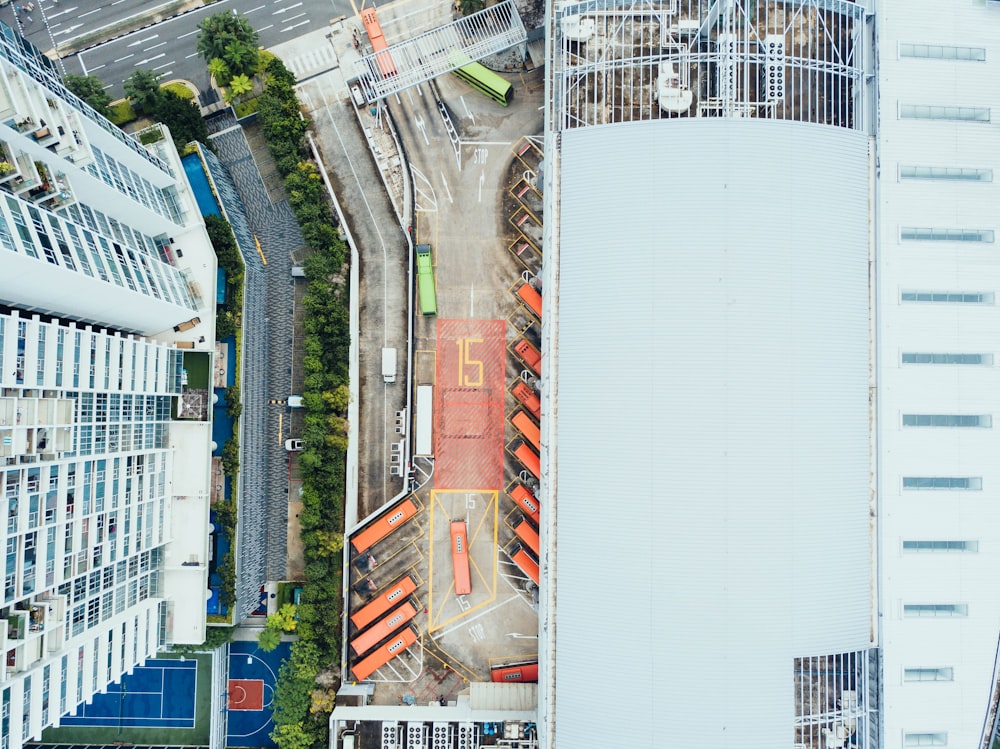 bird's-eye view photography of high-rise building beside asphalt road