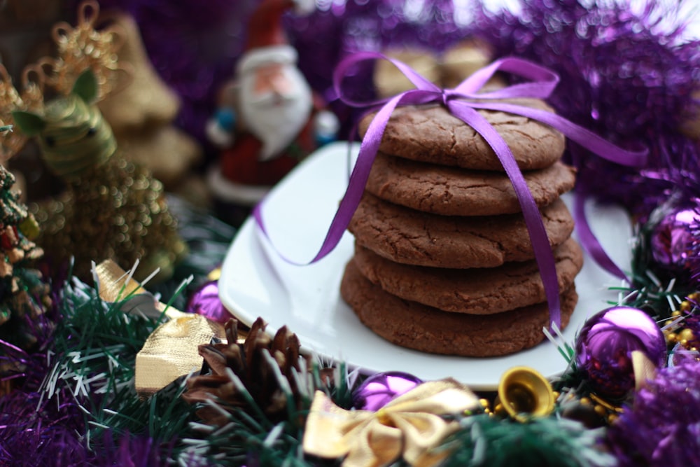 crinkles with purple ribbon on white ceramic saucer