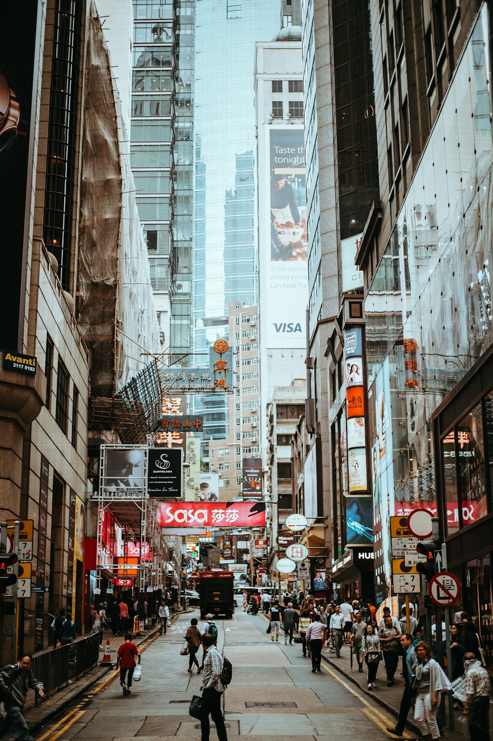 road in the middle of buildings during daytime