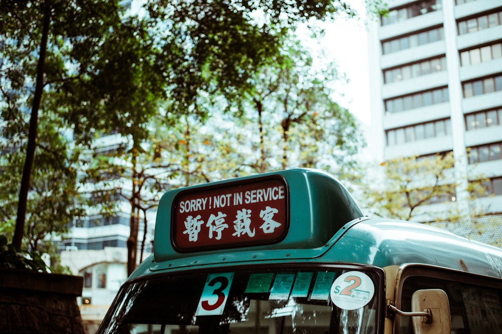 shallow focus photo of bus signage