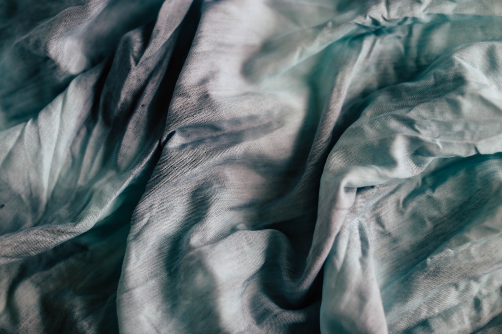 teal and grey textile