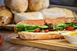baked bread with vegetable on brown chopping board