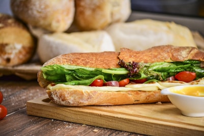 baked bread with vegetable on brown chopping board