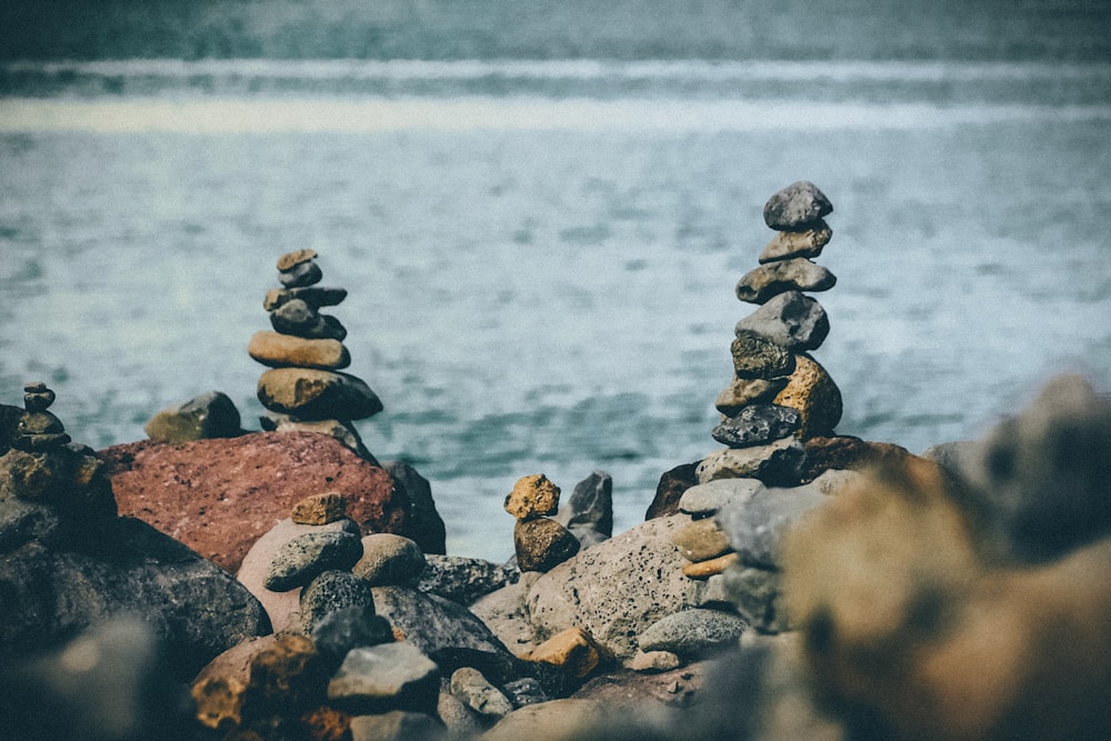 photo of balance rocks near body of water