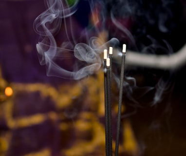 shallow focus photography of incense