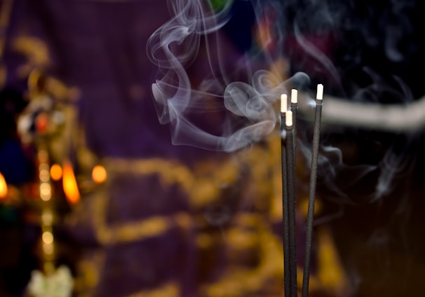 shallow focus photography of incense