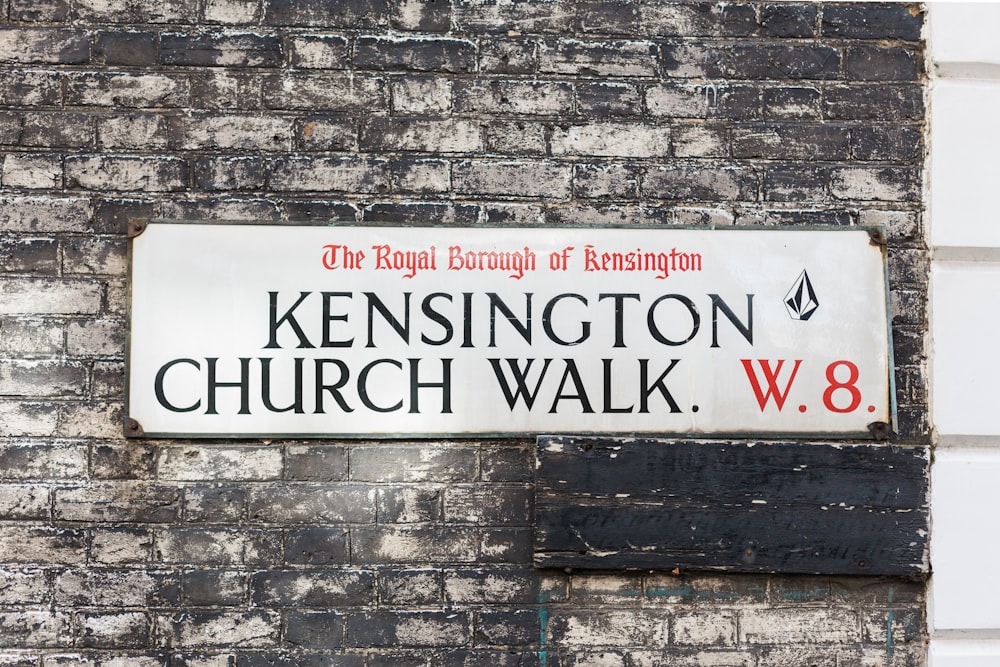 white signage mounted on wall