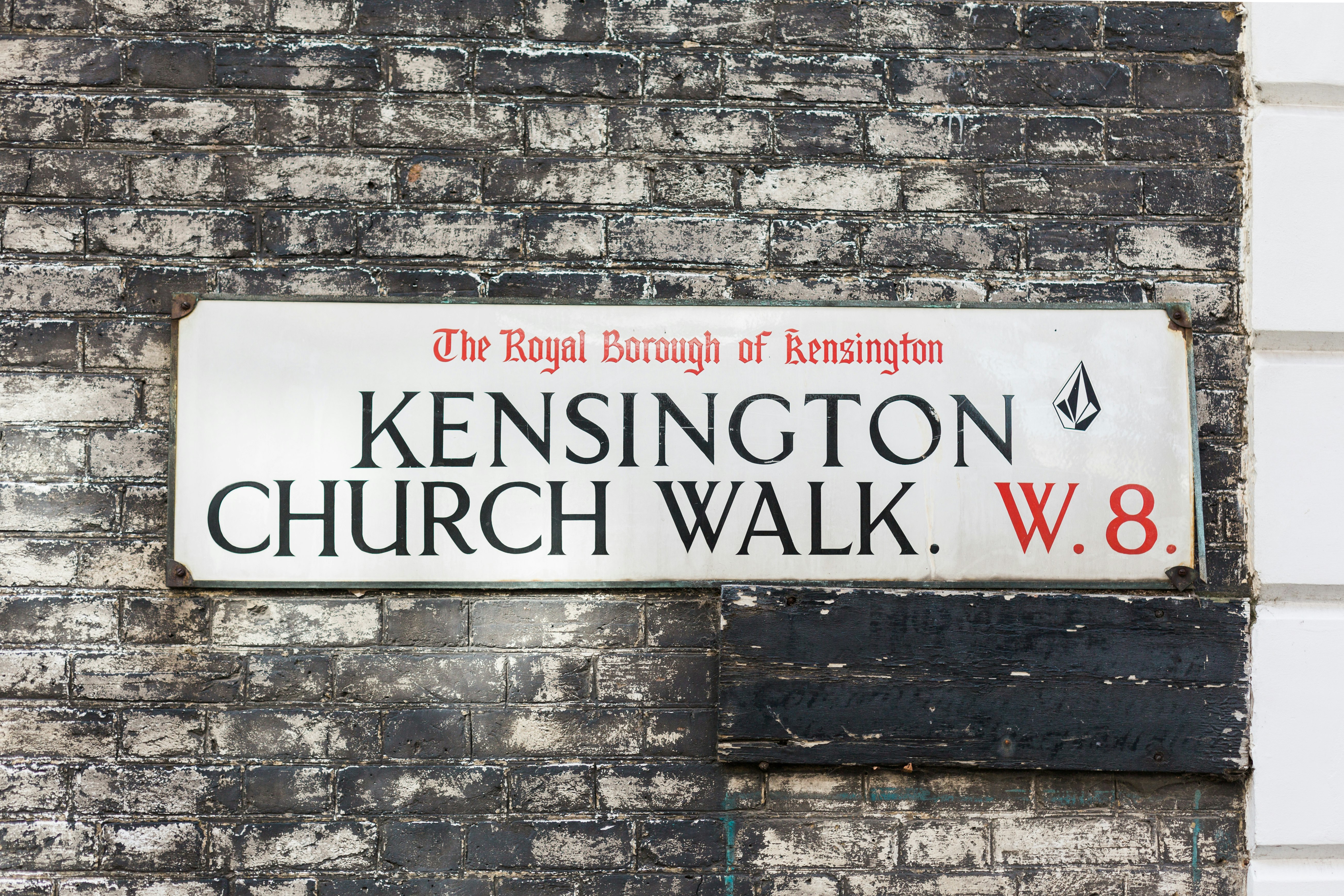 white signage mounted on wall