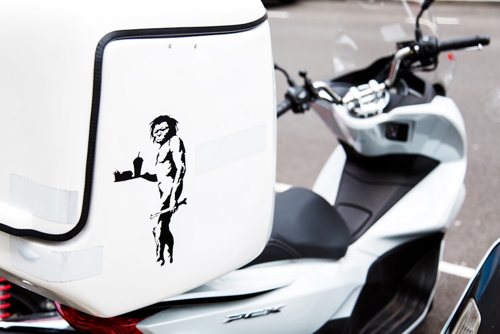 White and black motor scooter with top box photo – Free United kingdom  Image on Unsplash