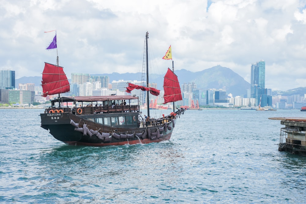 gray and brown Chinese merchant ship