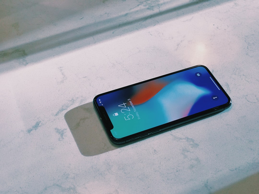 turned on silver iPhone X,