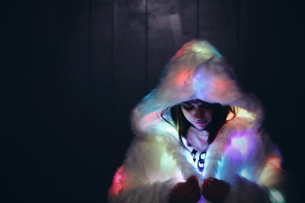 woman wearing lighted furry coat