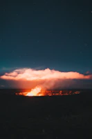 Scenic shot of the blue flames glowing at Kawah Ijen during night tour.