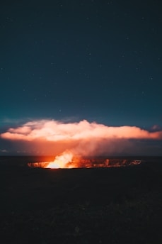 Night view of Ijen Crater glowing with bright electric blue flames