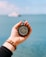person holding compass