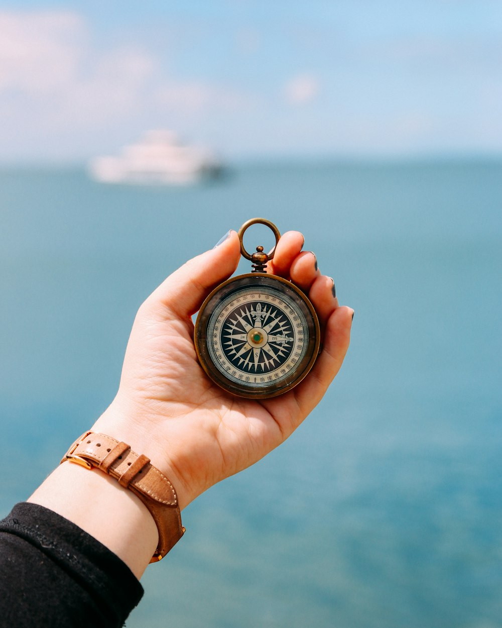 person holding compass