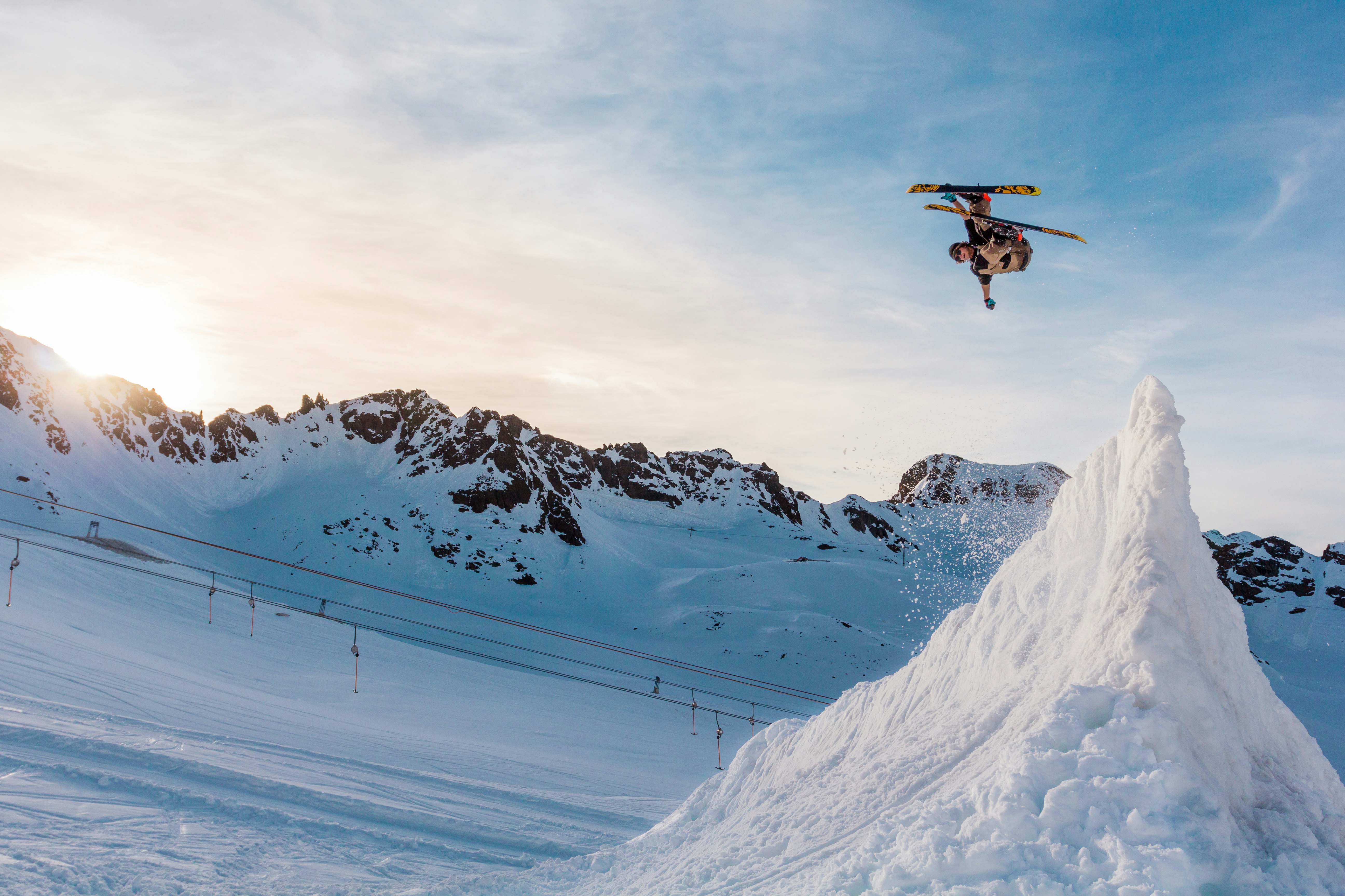 snow ski player ramping on the ice mountain