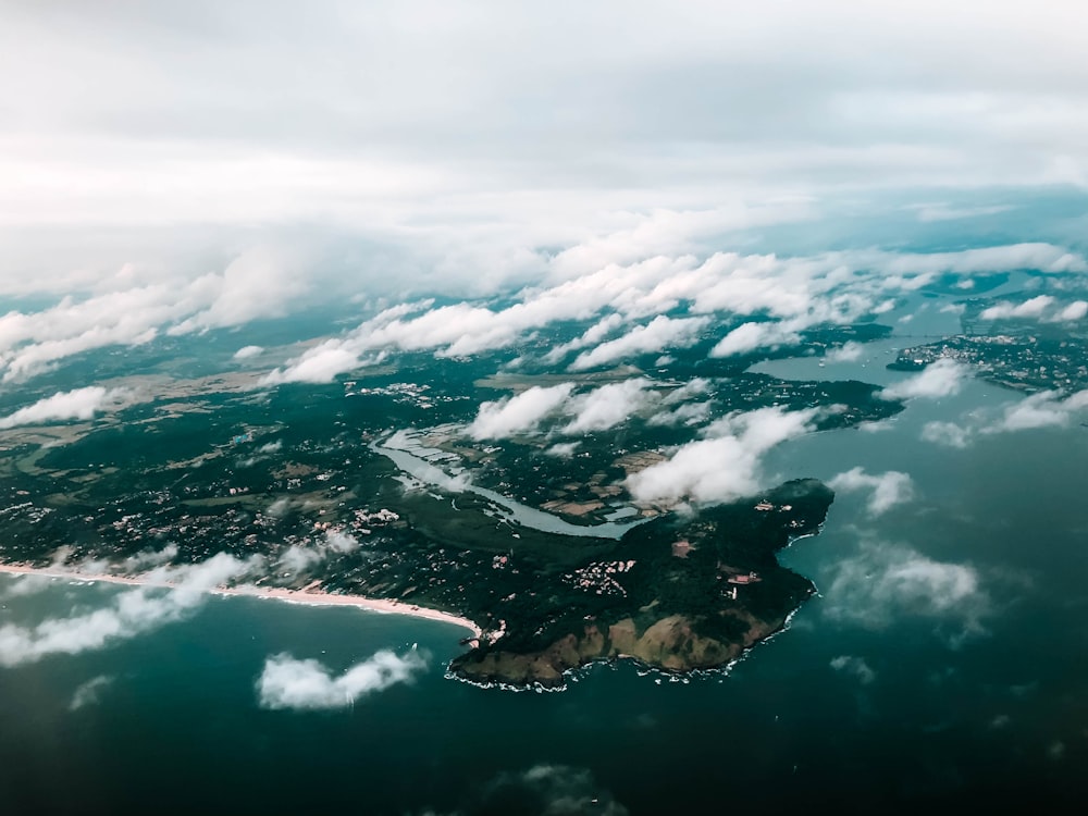 aerial photography of island and clouds