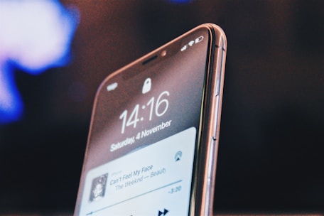 A close-up of a smartphone displaying a metronome app interface with a rhythmic beat.