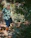 A smiling middle-aged woman enjoying a morning walk in nature