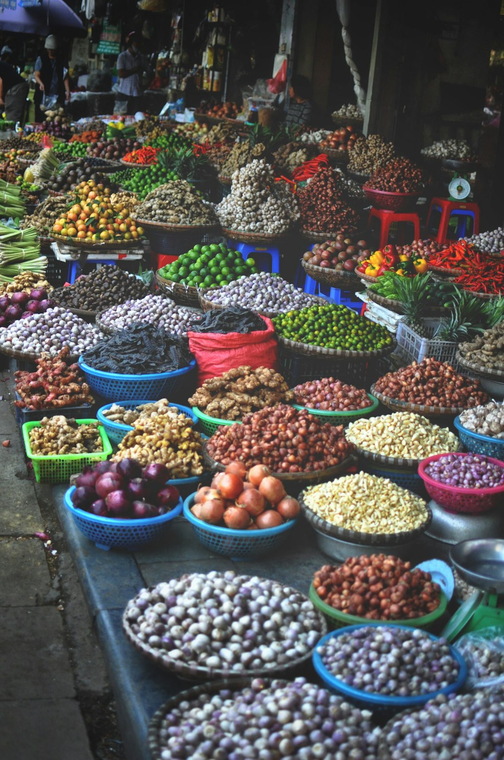 assorted spices on containers at the market