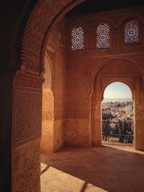 a view of a city through an arch in a building