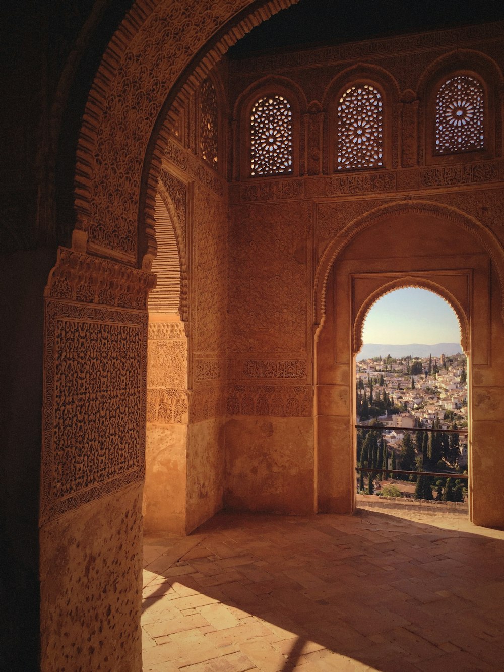 a view of a city through an arch in a building