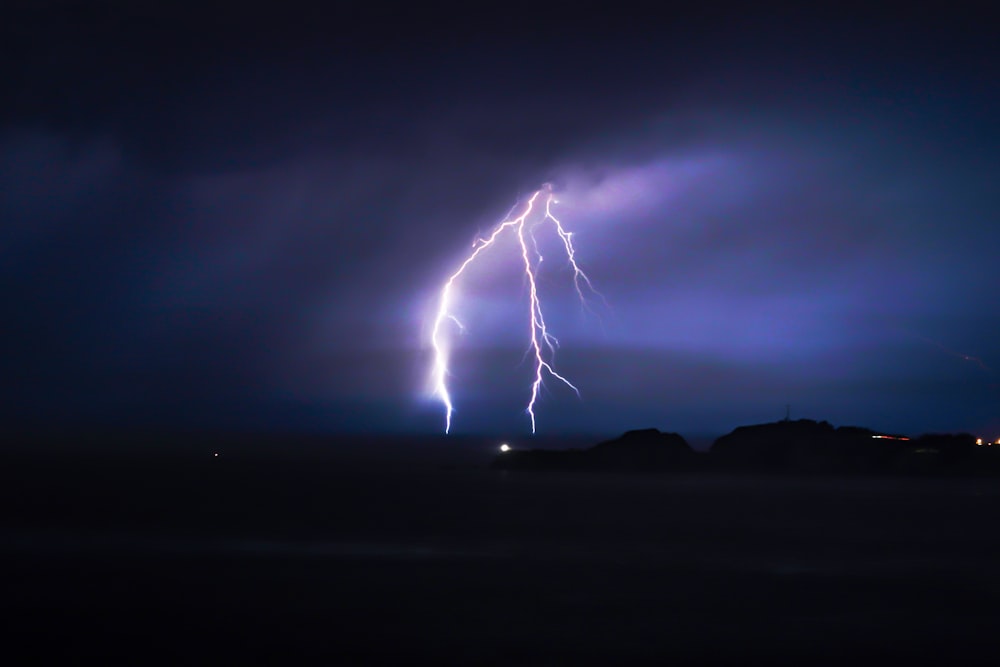 lightning at cloudy sky during night time