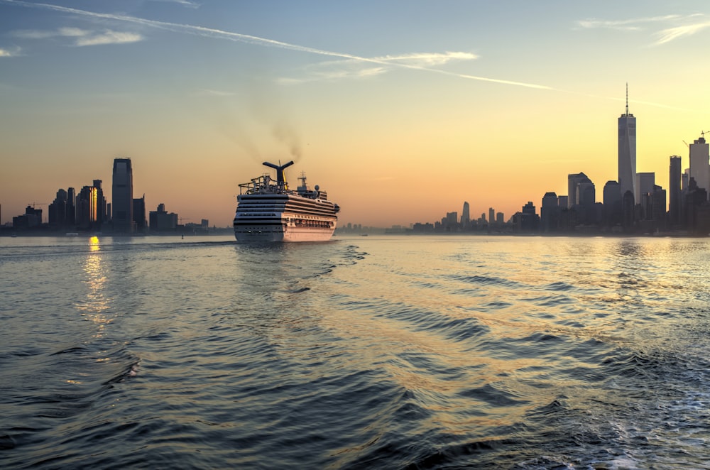 white and black cruise ship on body of water