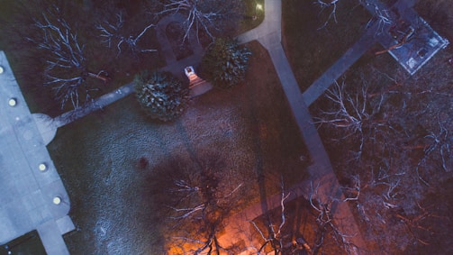 A panoramic view of a community park development with pathways and lighting.