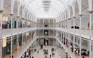 Cozy interior shot of the museum with visitors exploring exhibits on a weekend.