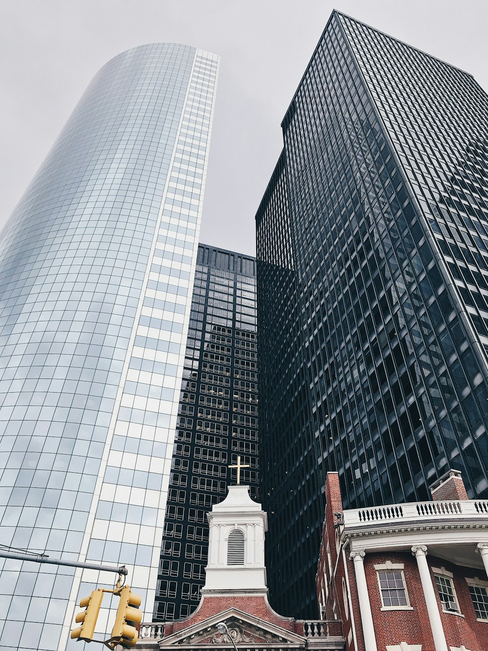 black and white high-rise buildings under white sky at daytime