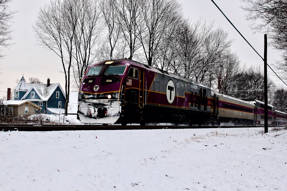 red and grey train running on train tracks