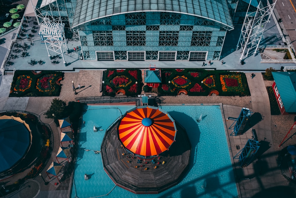 aerial photography of orange and red umbrella