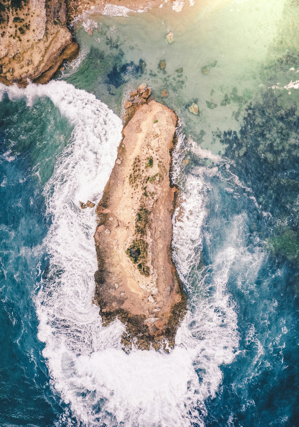 island on body of water during daytime