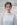 shallow focus photo of woman standing near wall