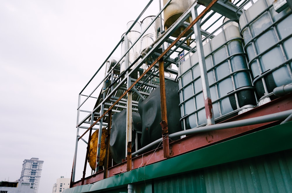 white IBC tanks on green building