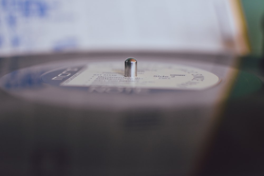 a close up of a metal object with a blurry background