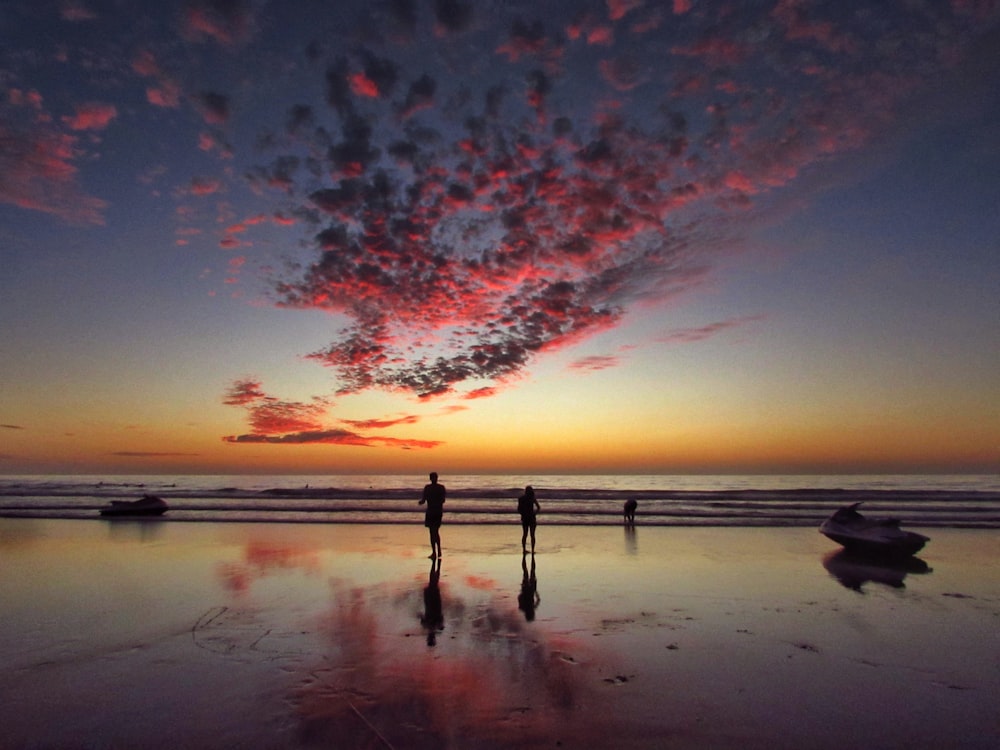 two person standing on shore