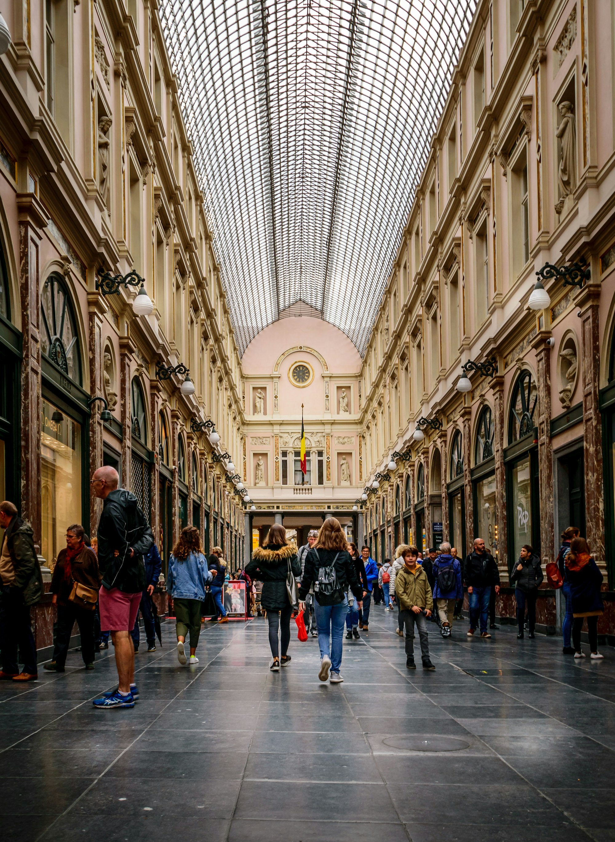 People walking in the Galeries Royales Saint-Hubert in Brussels, Belgium