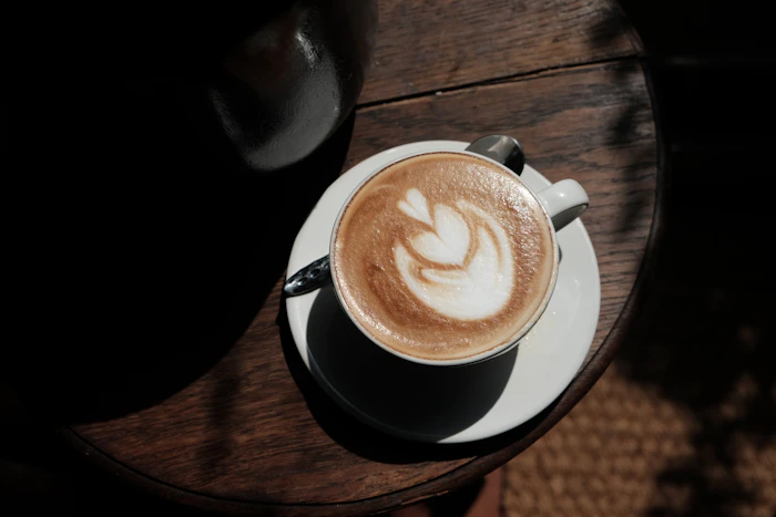 Latte art coffee cup on a wooden table